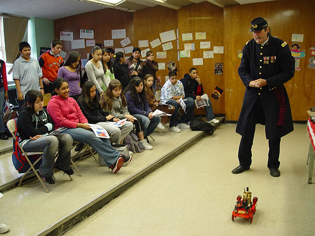 Your school was named after John Ericsson.  He invented a steam powered fire engine.  It was pulled by horses but the steam powered its hose.  After later improvements, the steam powered fire truck no longer needed horses.
