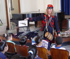 Janice is wearing a Hawkins' Zouave Vivandiere uniform.  A Vivandiere helped the wounded soldiers. She would carry drink for the soldiers in her keg.  She would carry a pistol for protection.   (92kb)