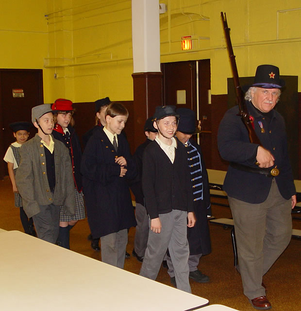 Arthur helps John with the recruits.