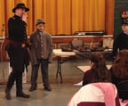 A confederate soldier was found in the class.  How can we tell?  He is wearing a gray uniform. (93kb)