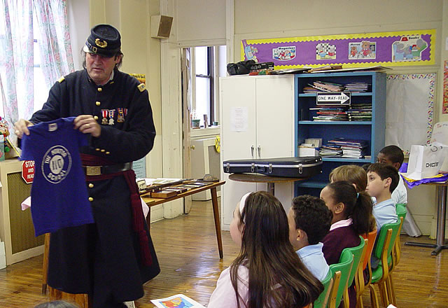George also graduated from PS 110 - the Monitor School.  Do you think his t-shirt still fits?