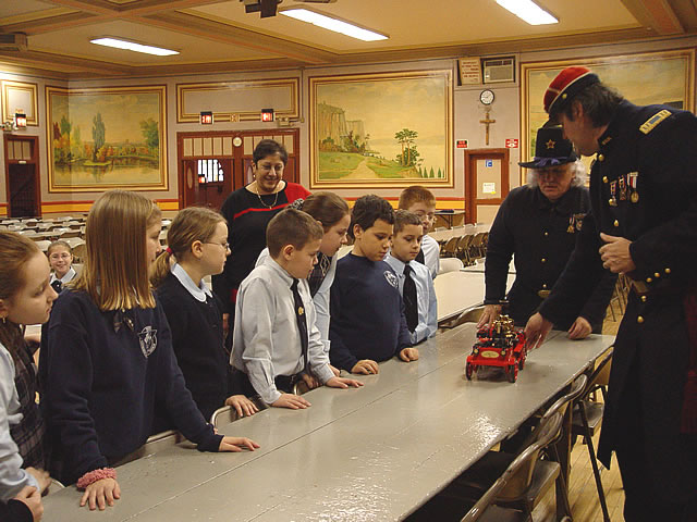 This fire engine runs by steam.  Water is heated in its boiler to create steam.