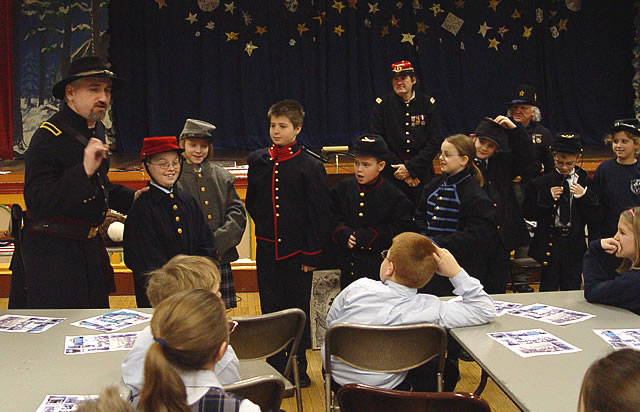 John is signing up his new St. Stans recruits.